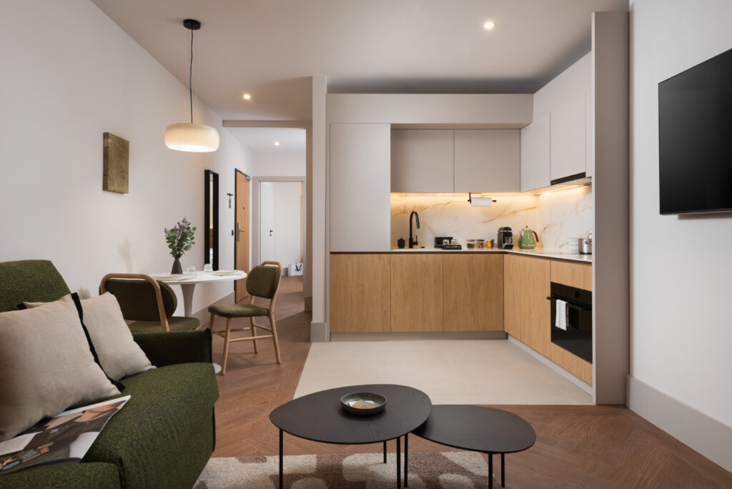 Fully equipped kitchenette and dining area in a one-bedroom apartment at master Wola Serviced Apartments
