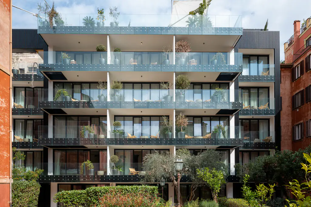 Facade of master Trevi Rome Aparthotel with elegant balconies overlooking the historic streets of Rome